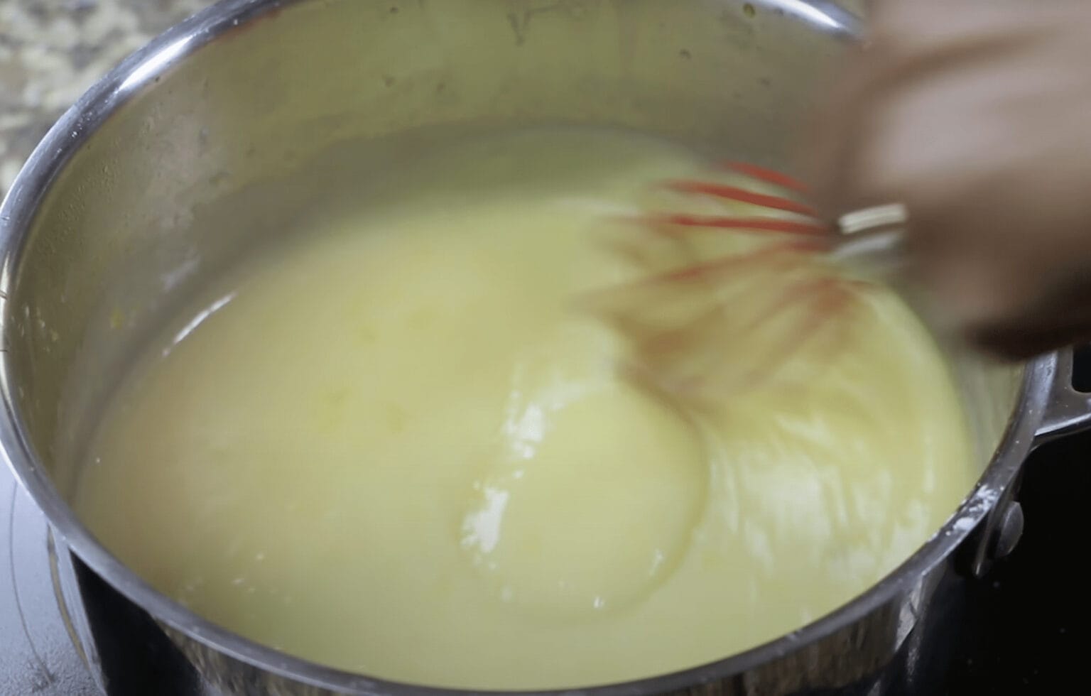 preparing filling for lemon meringue pie